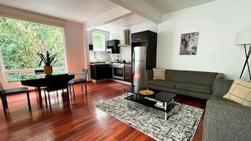 Design Apartment | Living area | 49-inch Smart TV with digital channels