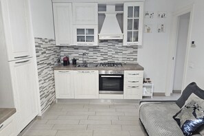 Fridge, oven, dishwasher, dining tables