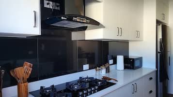 Fridge, microwave, stovetop, coffee/tea maker