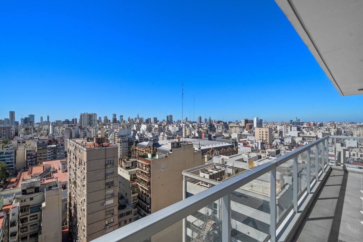 A high-rise building with a panoramic city view.
