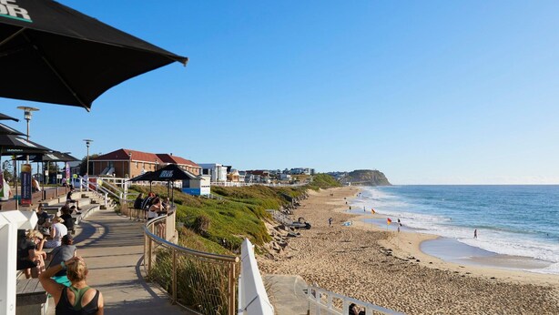 A beachside promenade with steps leading down to the beach, overlooking the ocean. - The Breeze - holiday apartment in Merewether, Newcastle (Merewether)