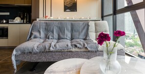 Signature Suite | Living area | 40-inch Smart TV with cable channels, Netflix, streaming services - Scarletz Suites by Travelet Experience (Kuala Lumpur)