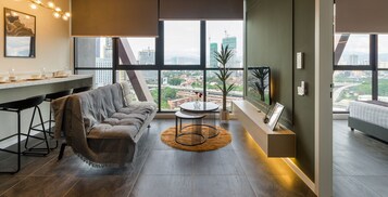 Signature Suite | Living area | 40-inch Smart TV with cable channels, Netflix, streaming services