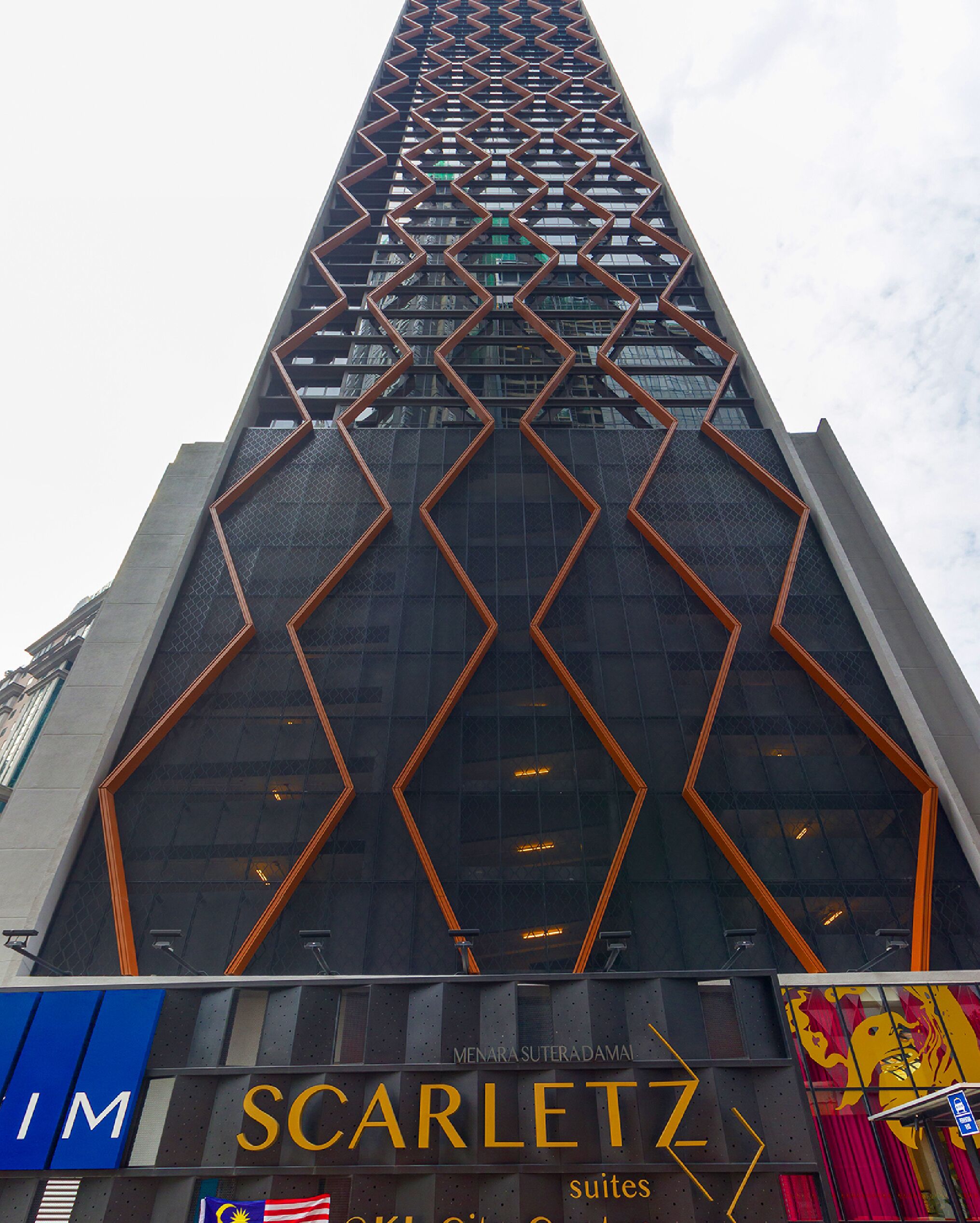 A tall building with a distinctive zigzag pattern on its facade, featuring the name 'Scarlett' prominently at the bottom.