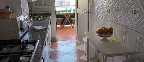 Fridge, microwave, coffee/tea maker, cookware/dishes/utensils