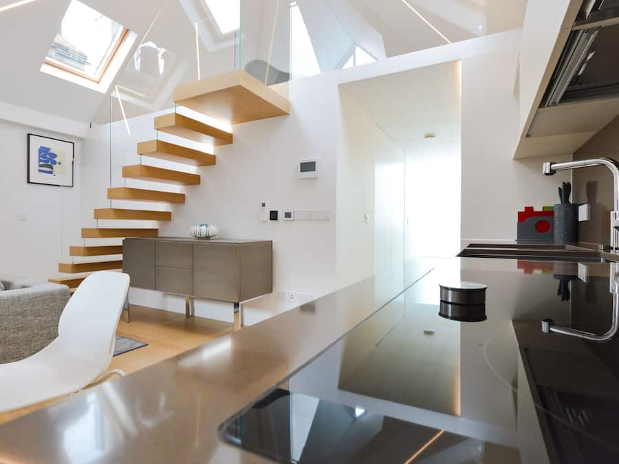 1 Bedroom Deluxe Penthouse | Living area | 32-inch flat-screen TV with cable channels, heated floors