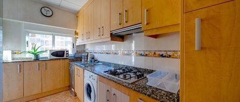 Fridge, microwave, toaster, cookware/dishes/utensils