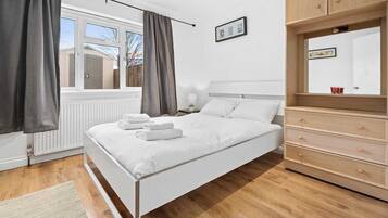 1 bedroom, desk, iron/ironing board, travel crib