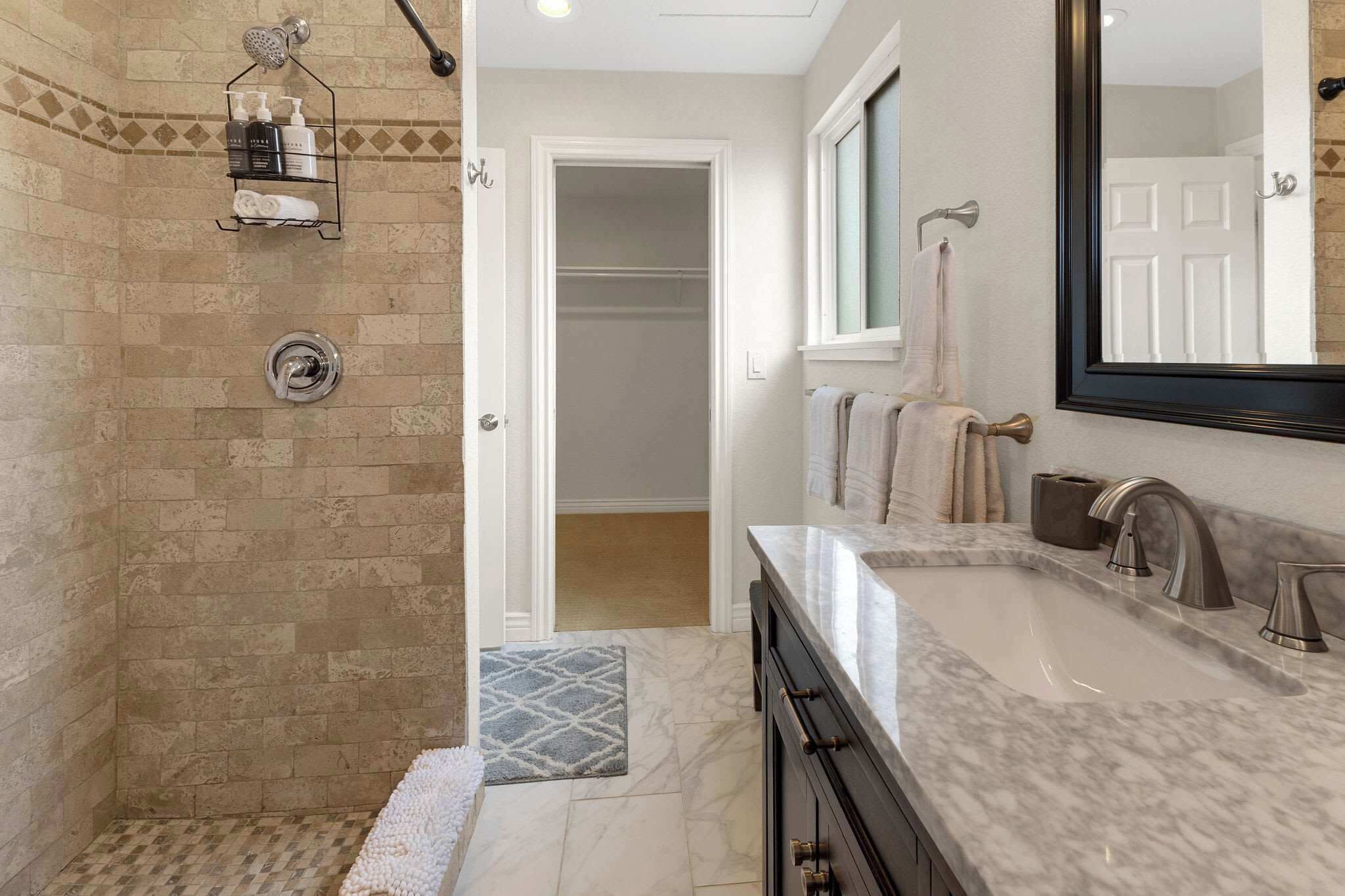Shower, hair dryer, towels, shampoo