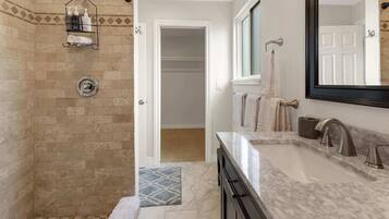 Shower, hair dryer, towels, shampoo
