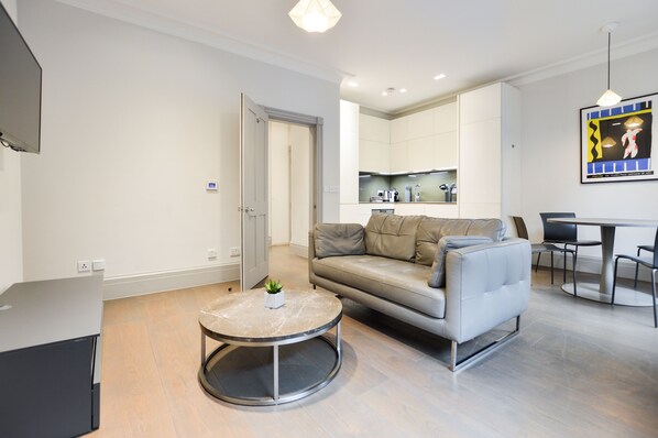 Soho Deluxe 1 Bedroom Apartment | Living area | Flat-screen TV, heated floors - Soho Deluxe 1 Bedroom Apartment by Concept Apartments (London)