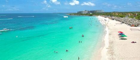 On the beach, sun loungers, beach towels