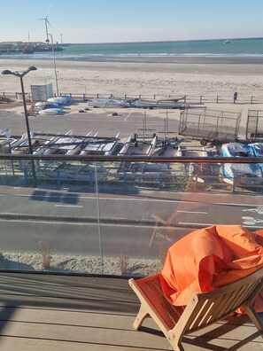 On the beach, sun loungers, beach towels
