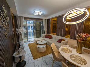 Luxury Apartment, 2 Bedrooms, Beach View, Beachfront | Living area | 40-inch Smart TV with digital channels