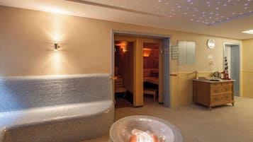 Relax in a serene space with a sauna, hot tub, and mosaic-tiled bench.