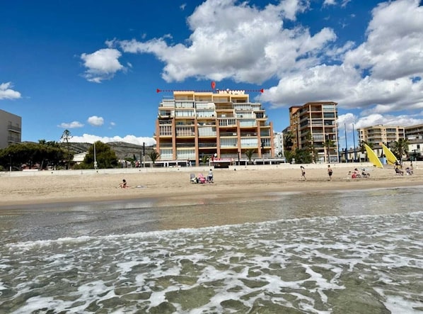 Enjoy stunning ocean views from your balcony overlooking the sandy beach.
