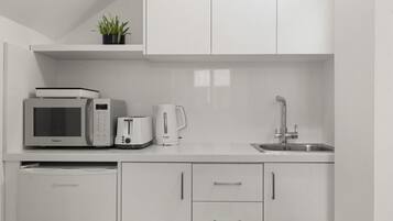 Microwave, stovetop, coffee/tea maker, toaster