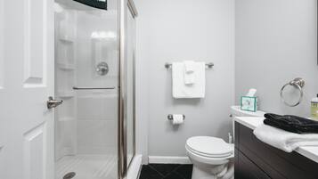 Shower, hair dryer, towels, shampoo