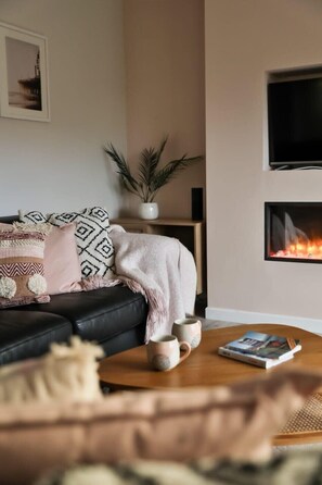 TV, fireplace, books, offices
