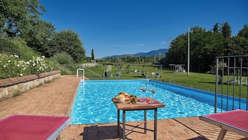 Seasonal outdoor pool, open 9:30 AM to 7:30 PM, pool umbrellas