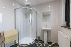 Shower, hair dryer, towels, shampoo