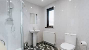Shower, hair dryer, towels, shampoo