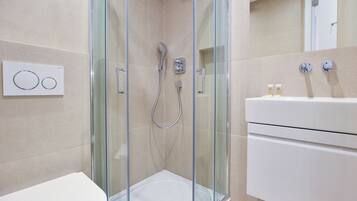 Small Studio Apartments | Bathroom | Shower, hair dryer, heated floors, towels