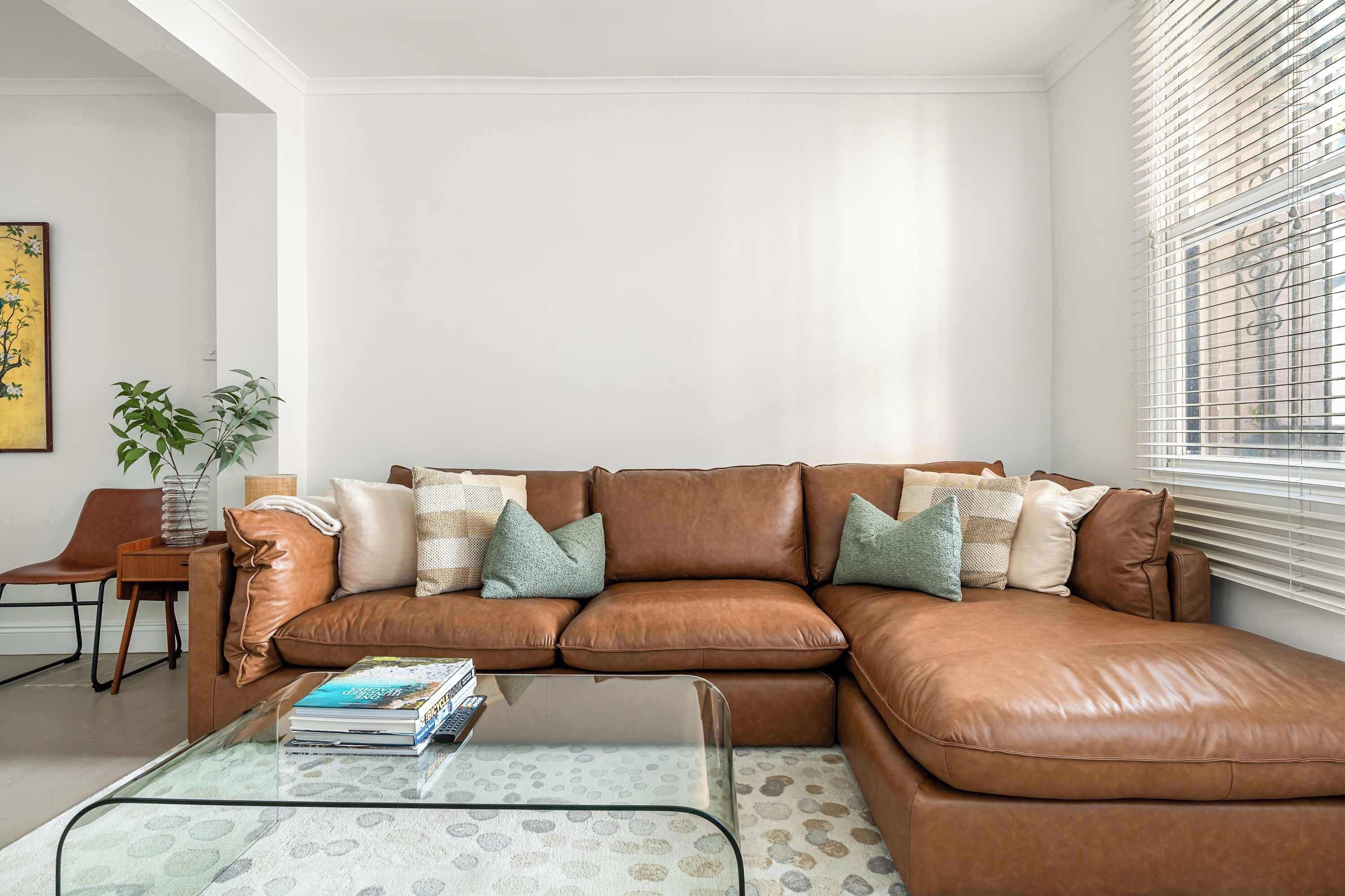 Our premium leather couch adds a touch of elegance to the living area—complete with a high-definition TV for your entertainment.