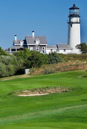 A coastal property with a lighthouse, a large house with multiple windows, and a well-maintained lawn. - 5 Min. Drive to Fisher Beach and Pamet Harbor! (Truro)