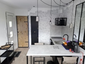 Fridge, microwave, stovetop, coffee/tea maker