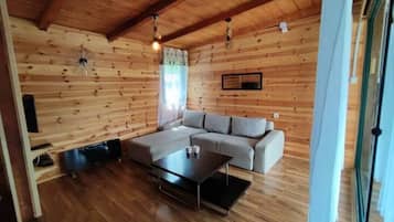 Comfort House | Living area | 32-inch LCD TV with cable channels