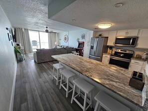 Fridge, microwave, oven, stovetop - Garden City Beach Oceanfront Condo 306 | Rising Tides Properties Rental (Murrells Inlet)