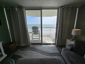 TV, fireplace - Garden City Beach Oceanfront Condo 306 | Rising Tides Properties Rental (Murrells Inlet)