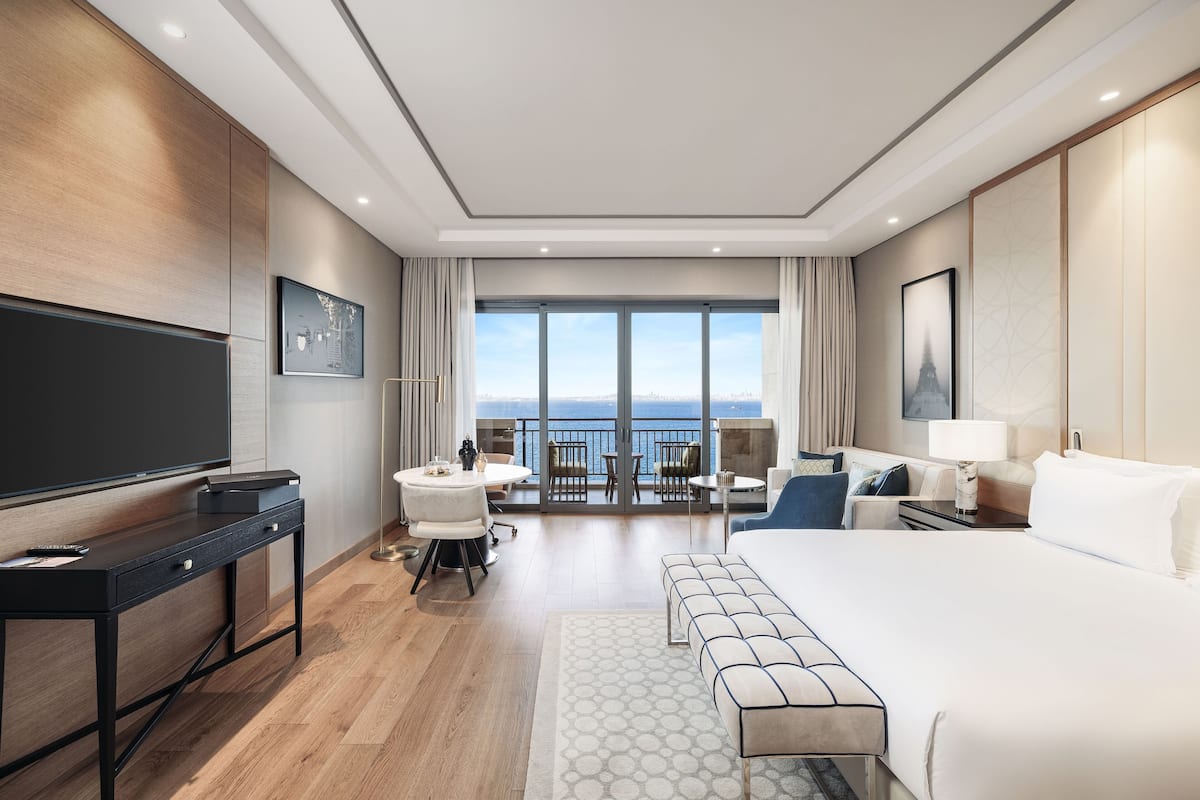 Deluxe Double Room, Sea View | Minibar, in-room safe, laptop workspace, blackout drapes