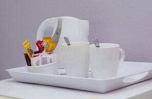 Individually decorated, desk, laptop workspace, iron/ironing board