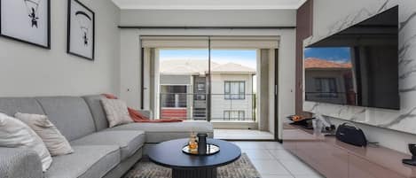 Apartamento | Área de estar | TV