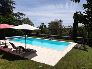 Seasonal outdoor pool, open 10:00 AM to 8:00 PM, pool umbrellas