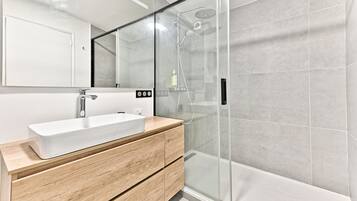 Shower, towels, soap, toilet paper