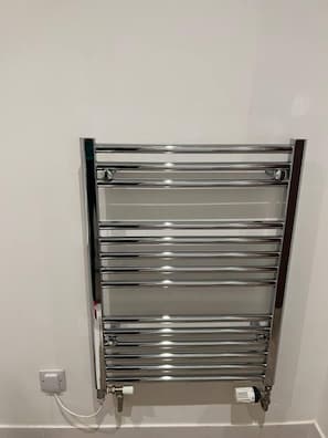 Towels are warmed and ready to use with this wall-mounted warmer.