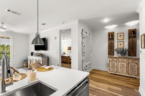 A modern kitchen with a white countertop, stainless steel sink, and a built-in dishwasher. - Luxurious Coastal Retreat w/ Amazing Amenities + Free Attraction Tickets! (Santa Rosa Beach)