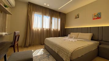 Deluxe Double Room, 1 King Bed, City View | Minibar, in-room safe, desk, laptop workspace