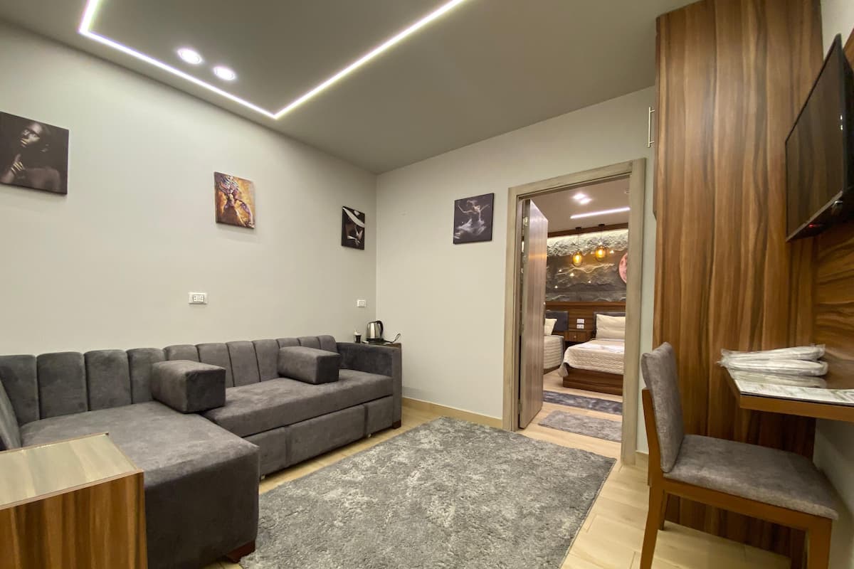 Family Room, Multiple Beds, Balcony | Living area | 32-inch TV with satellite channels