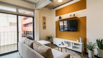 Deluxe Apartment, 1 Bedroom | Living area | 43-inch Smart TV with digital channels, streaming services