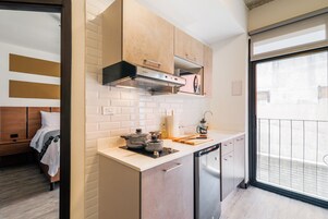 Deluxe Apartment, 1 Bedroom | Private kitchen | Full-size fridge, microwave, stovetop, coffee/tea maker