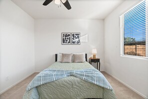 Queen sized bed in bedroom located on the main level