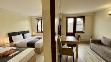 Deluxe Apartment | Living area | 100-cm LED TV with cable channels