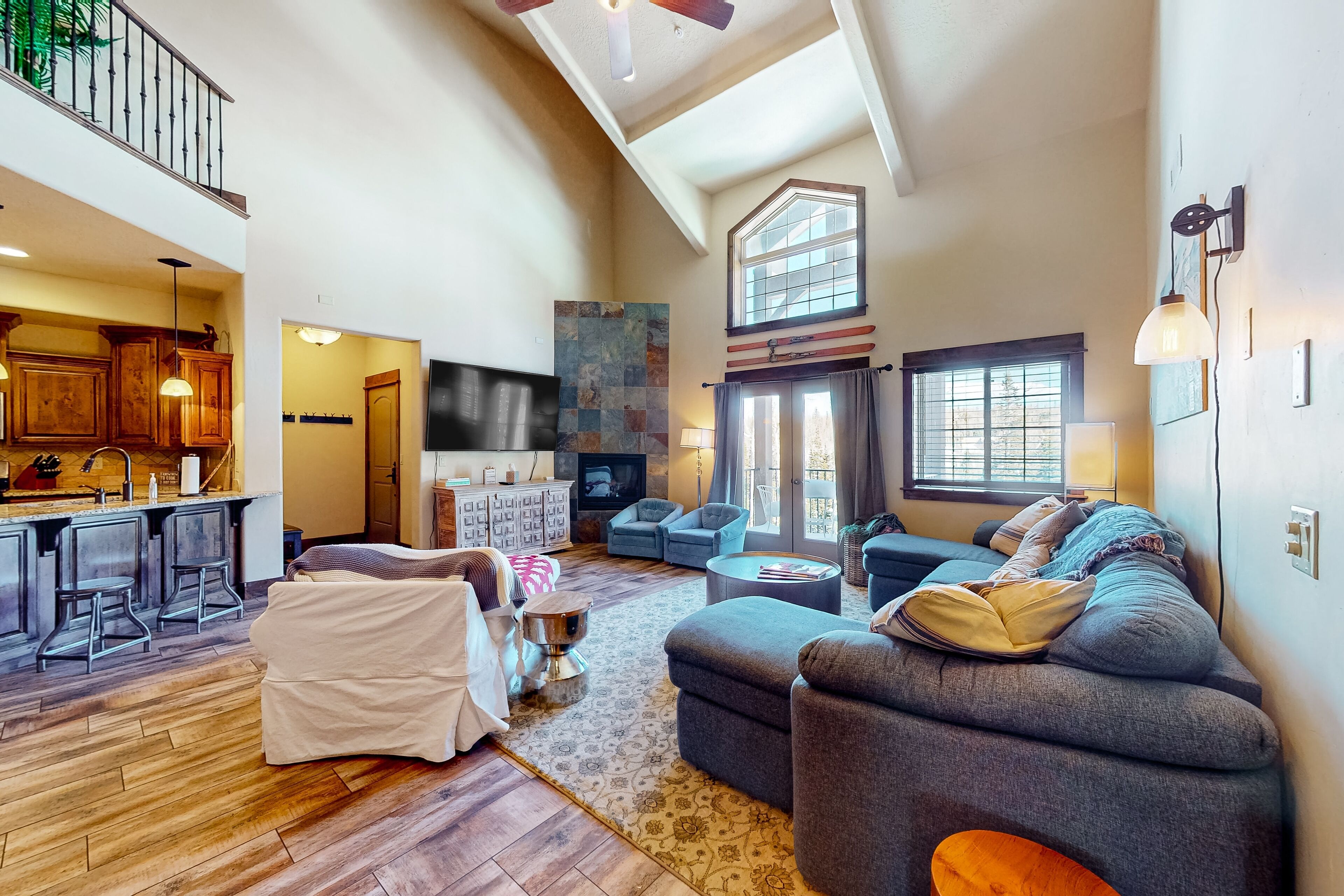 Sun-kissed two-story townhouse with balcony, mountain views, & washer/dryer