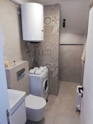 Hair dryer, slippers, towels, soap