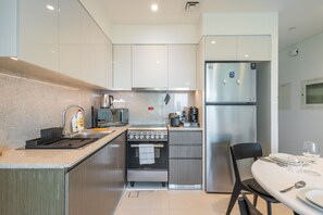 Private kitchen - SuperHost - Sleek 2BR Burj Royale Apt Close to Burj Khalifa  (Dubai)