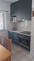 Family Apartment | Private kitchen | Shared fridge, microwave